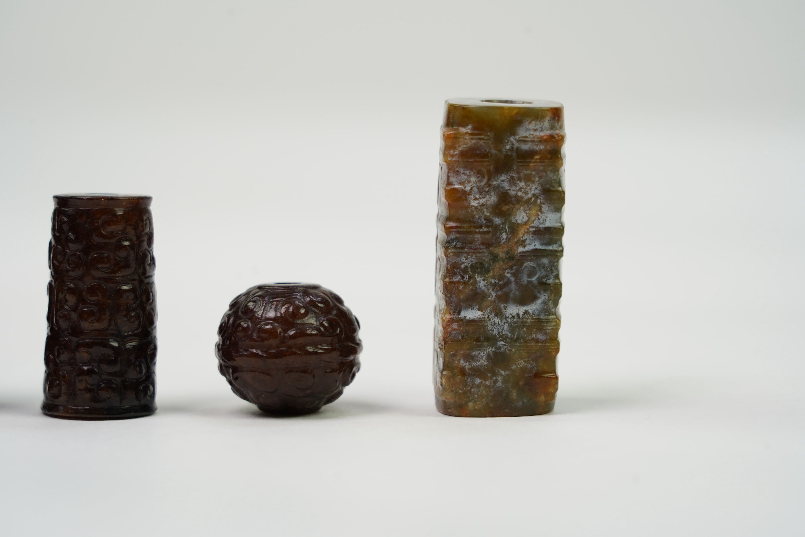 A group of four Chinese archaistic jade beads